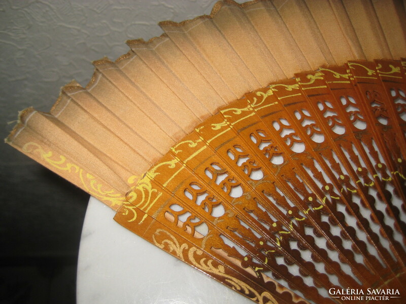 A fan, a beautiful, showy oriental object