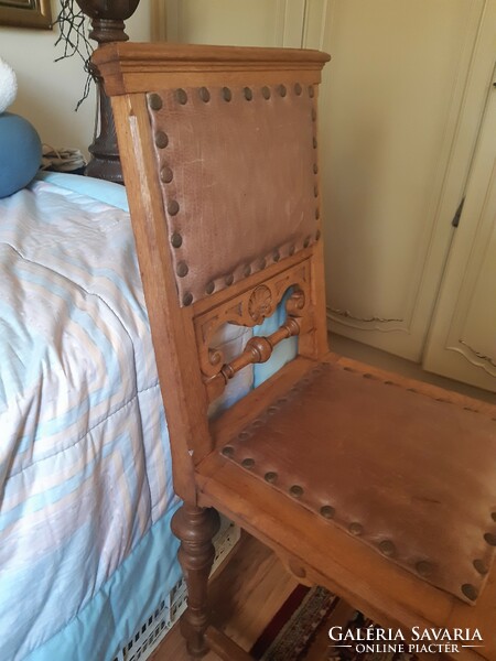 Antique chair with leather upholstery