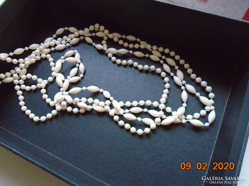 White, long, 2-row necklace of elongated and round pearls