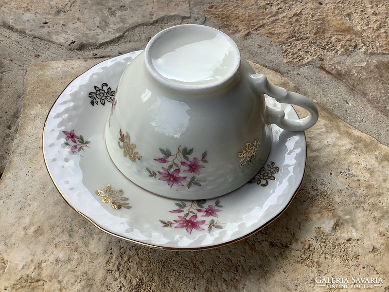 Tea or cappuccino porcelain cup with a bottom and a pair of scented candles