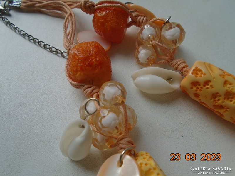 Unique handmade necklace of carved bone, polished seashell and clustered acrylic beads