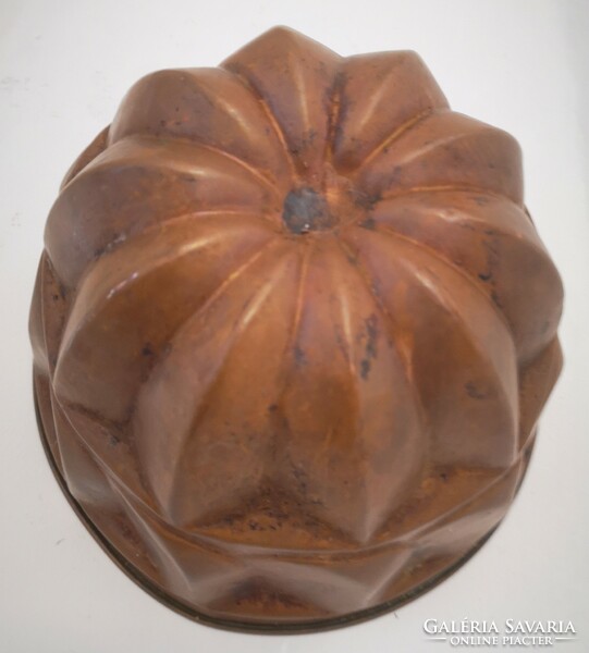 Old red copper kuglóf oven form, decoration in collection, kitchen confectionery