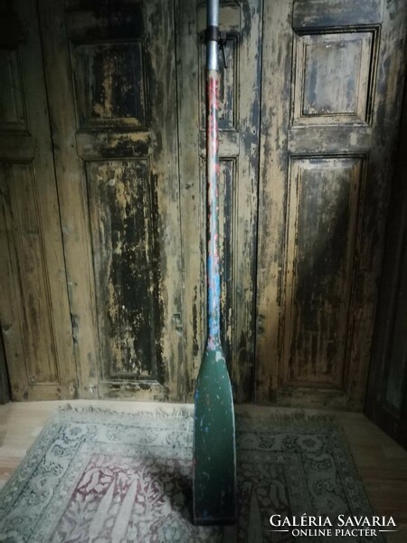 Oar, dark green old wooden oar for sale as decoration.