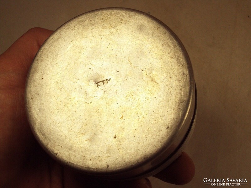 Old retro laboratory glass jar in an aluminum box