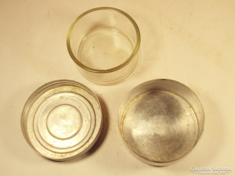 Old retro laboratory glass jar in an aluminum box