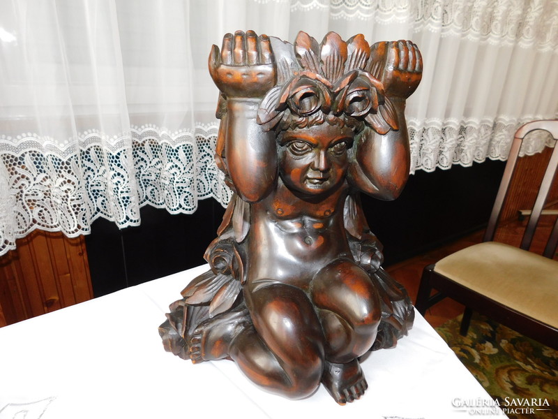 Very old solid wooden sculpture