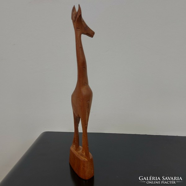 Giraffe sculpture carved from wood