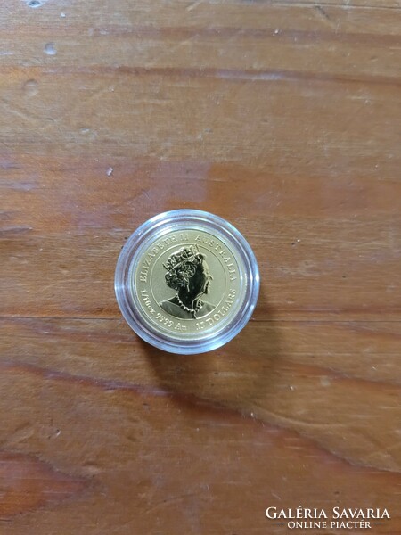 Gold lunar iii 2021 ox color gold coin. 1/10 oz
