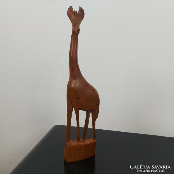 Giraffe sculpture carved from wood