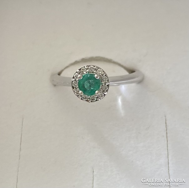 18 carat white gold ring with emeralds and diamonds!