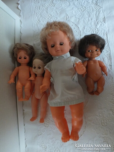 Old dolls in a package, one of them is ari