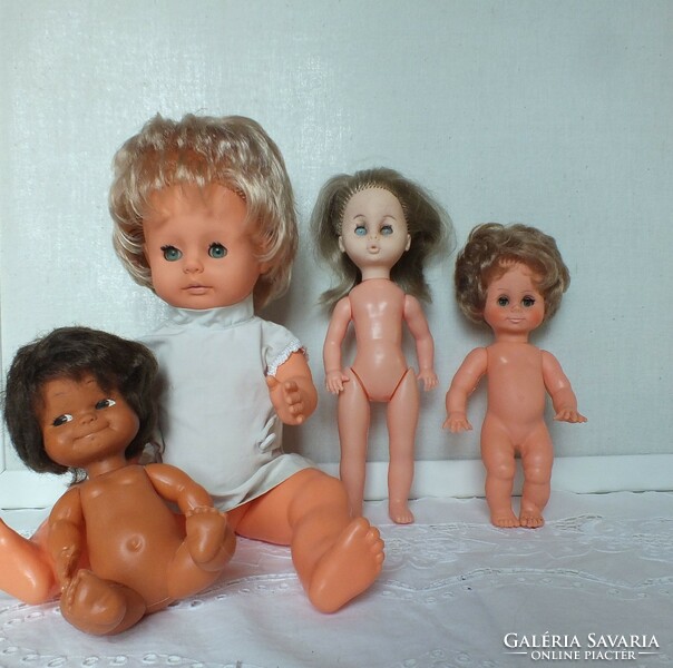 Old dolls in a package, one of them is ari