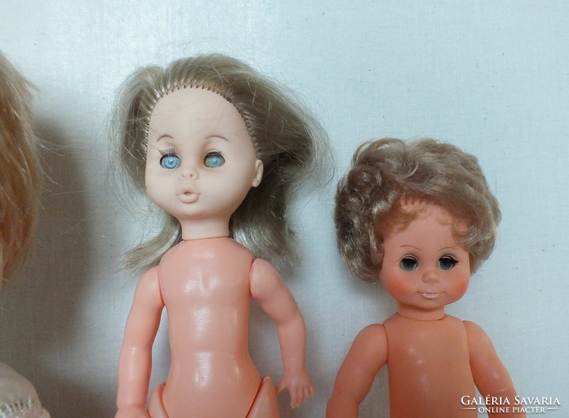 Old dolls in a package, one of them is ari