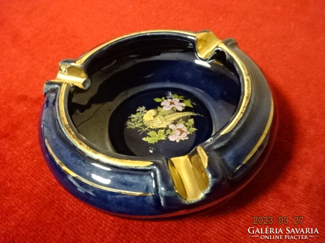 German glazed ceramic ashtray. Cobalt blue background with gold pheasant pattern. Jokai.