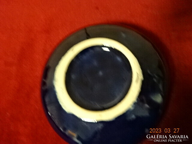 German glazed ceramic ashtray, decorated with a gold pheasant on a cobalt blue base. Jokai.