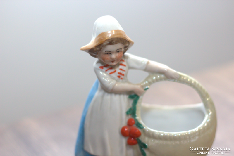 Porcelain girl with a basket