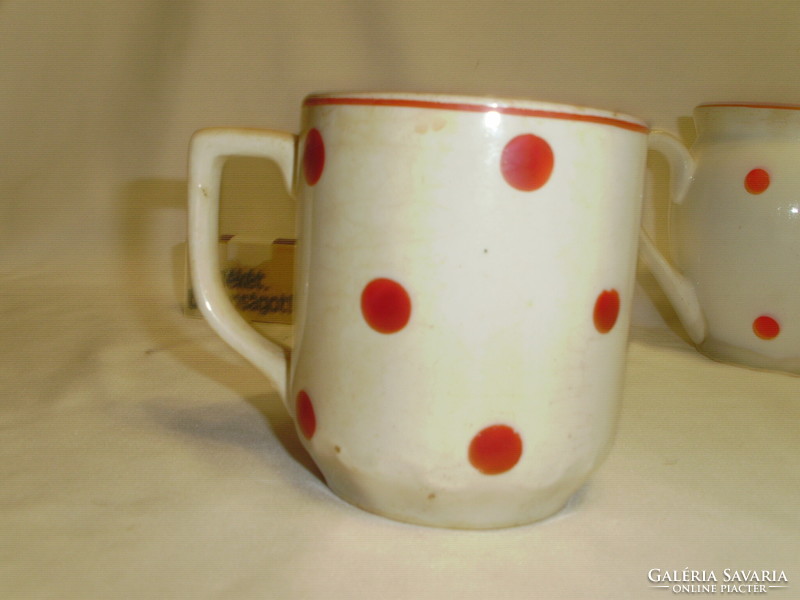 Three old red polka dot granite mugs together - one belly, two tea