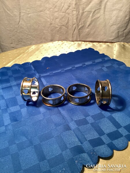 Napkin rings with silver-plated hearts.