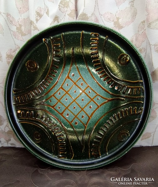 Green glazed ceramic decorative plate