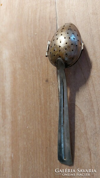 Old tea egg and tea herb spoon with patina