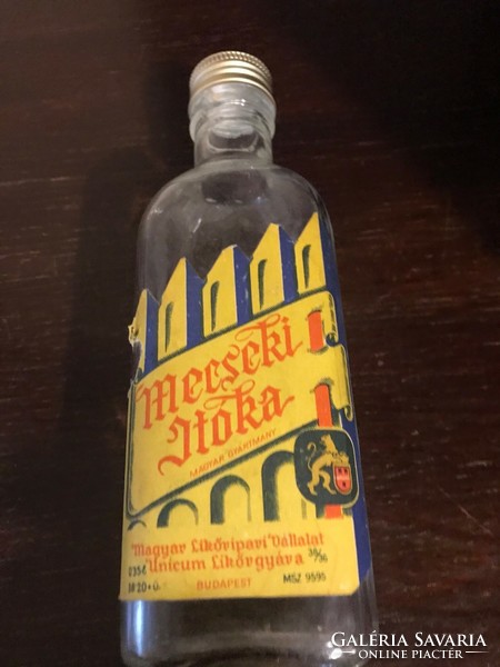 Glass bottles of Mecseki drinking glass / Hungarian liquor company Unicum Liquor Factory in Budapest are undamaged