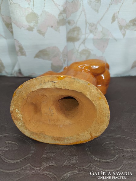 Yellow ceramic putto candle holder