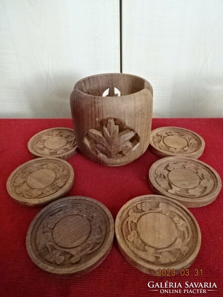 Carved wooden coaster and holder. Jokai.