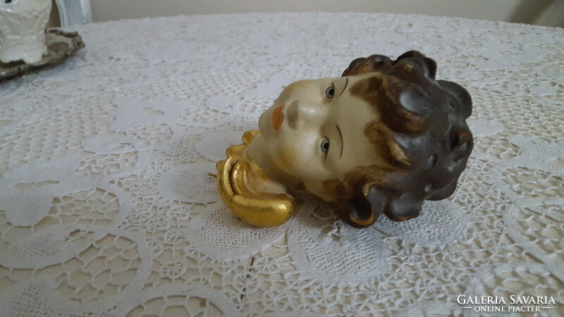 Old painted angel head