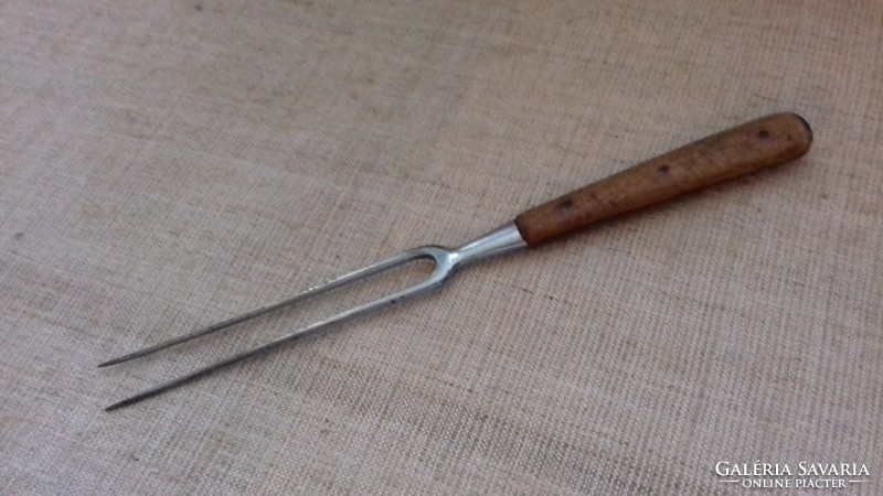 Old artificial meatpin with wooden handle