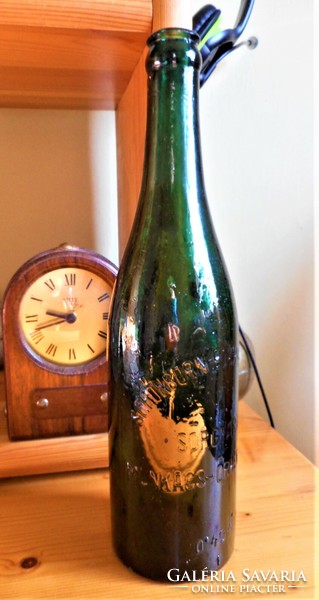 Old embossed beer bottle about a worker