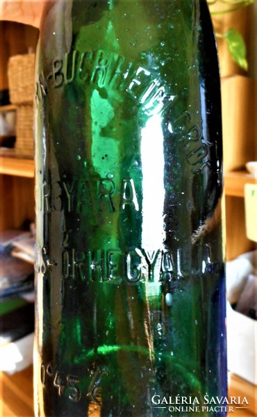 Old embossed beer bottle about a worker
