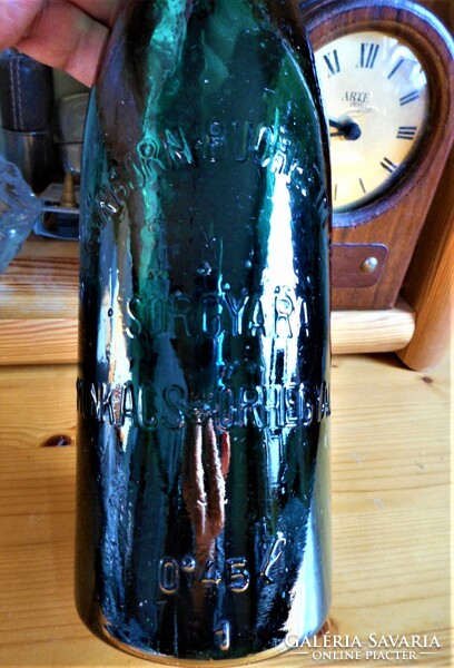 Old embossed beer bottle about a worker
