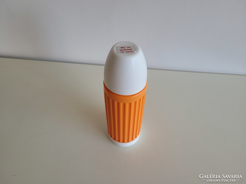 Retro orange thermos with old glass insert