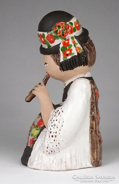 1M526 marked ceramic lad playing the flute in folk costume 19.5 Cm