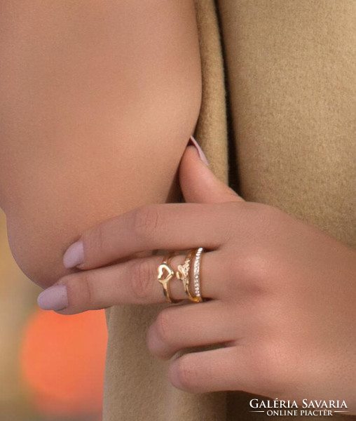 Gold-colored love ring with a heart and crystals