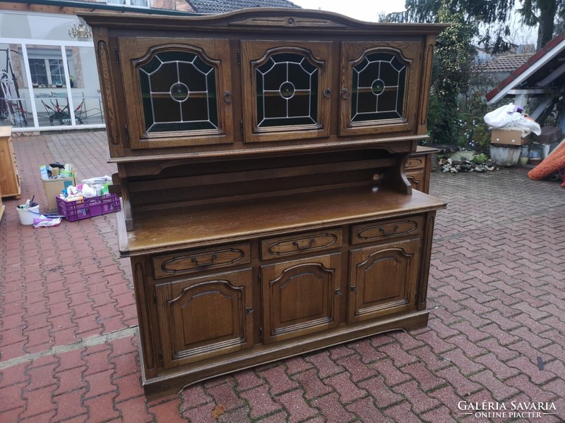 Glass cabinet with a small chest of drawers