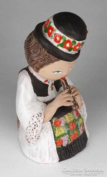 1M526 marked ceramic lad playing the flute in folk costume 19.5 Cm