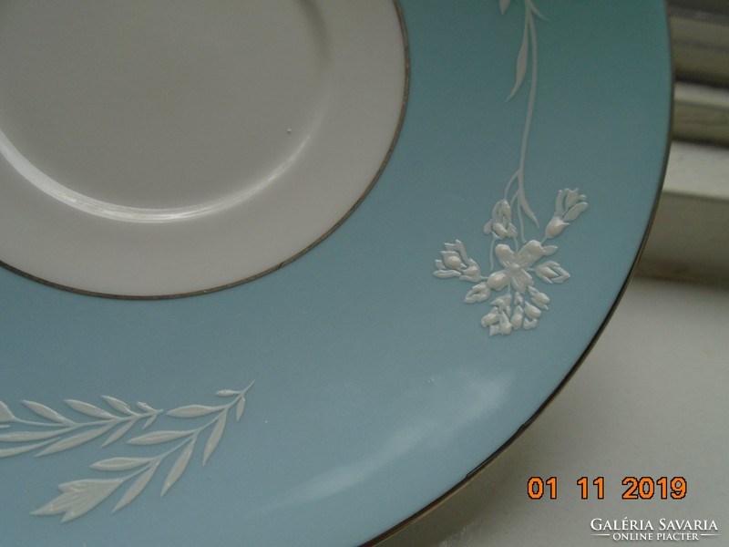 Minton plate with white enamel cameo pattern on a turquoise background