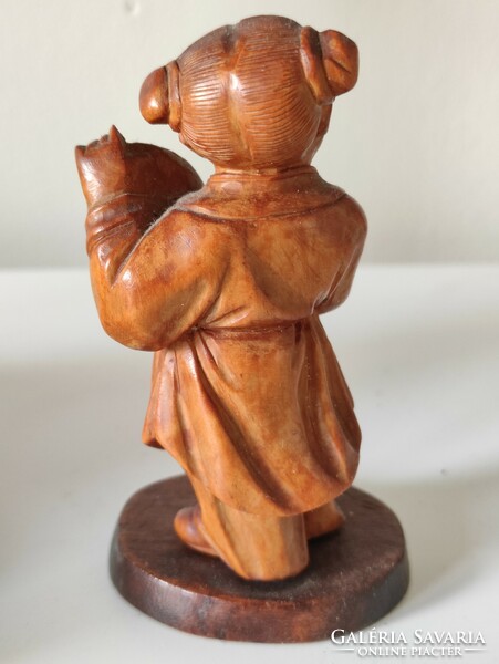 Chinese little girl with drumming pigtail hairstyle, small wooden figurine