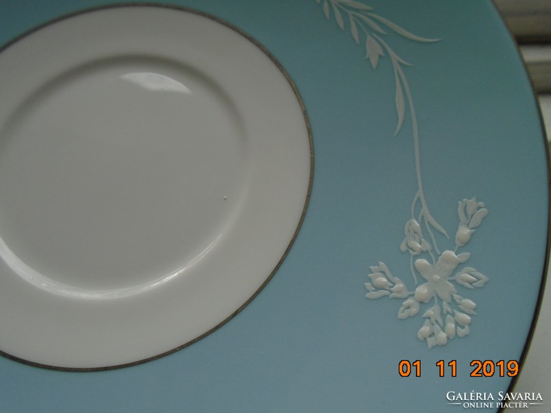 Minton plate with white enamel cameo pattern on a turquoise background