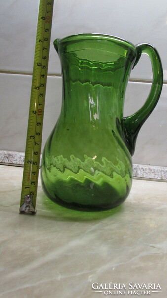 Broken green glass jug