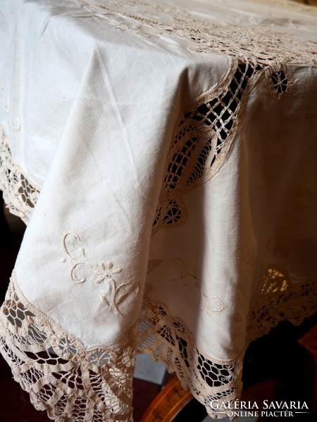 Beautiful embroidered tablecloth decorated with ribbon crochet