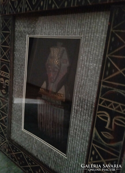 A special African showcase picture with an inlaid metal replica of a tribal comb