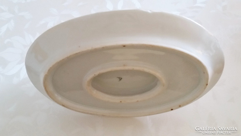Old porcelain rosy sauce with rosemary sauce in vintage bowl