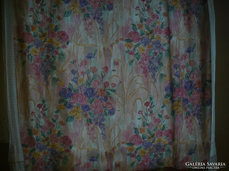 A pair of cheerful floral summer blackout curtains in a beautiful vintage style