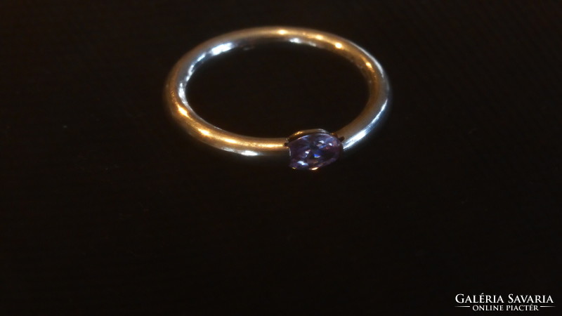 Silver wedding ring with purple translucent stone