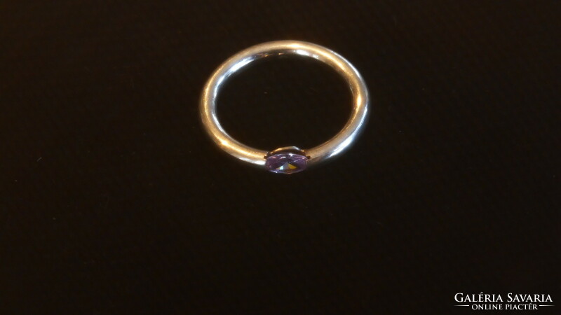 Silver wedding ring with purple translucent stone