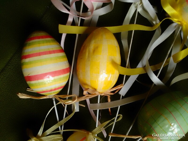 Paper-coated, lacquered, colorful, ribbon, stick-on male Easter egg decoration on a plastic base