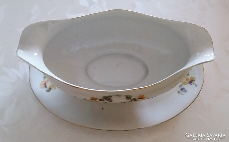 Old porcelain rosy sauce with rosemary sauce in vintage bowl