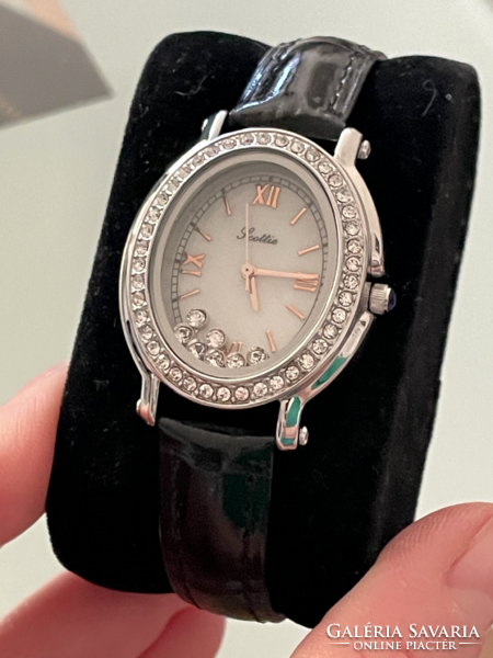 A beautiful women's jewelry watch inspired by Chopard with floating crystals